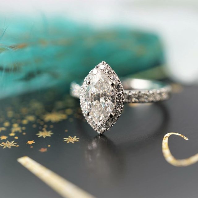 Marquise diamond halo engagement ring