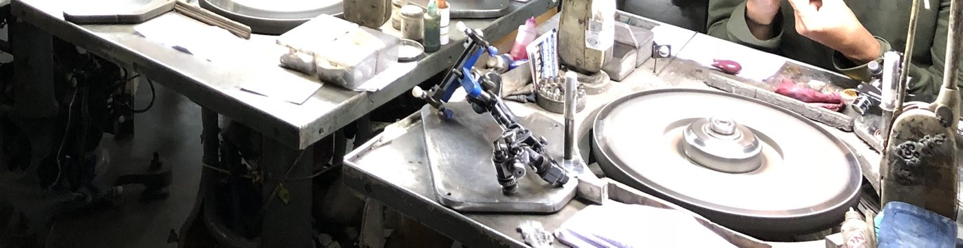 Rows of diamond polishing wheels on a workshop floor